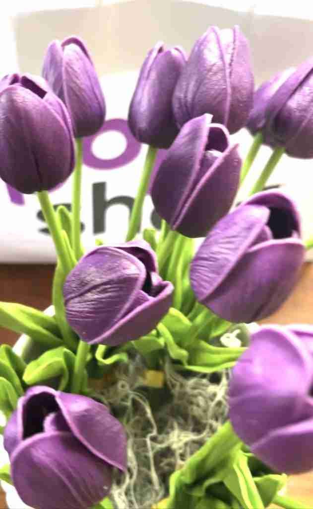 Pop Shelf purple tulips with stems bent, inserted into container with moss added
