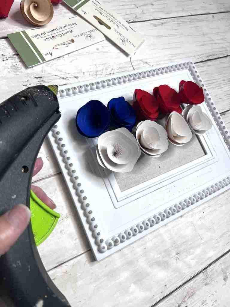 painted wood curls attached to the center of Dollar Tree frame