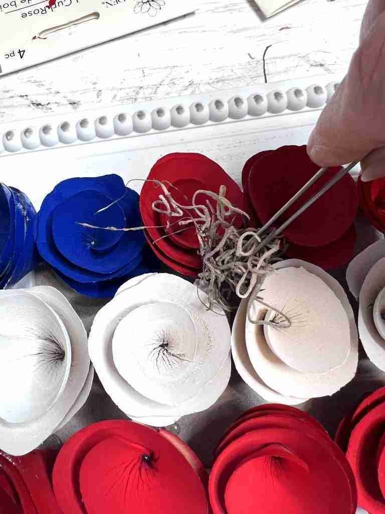 Spanish moss inserted in between the wood curls