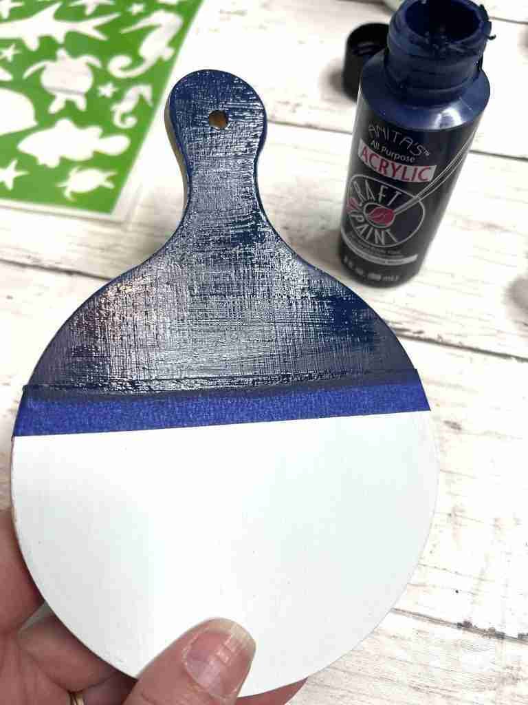 cutting board with top portion painted blue