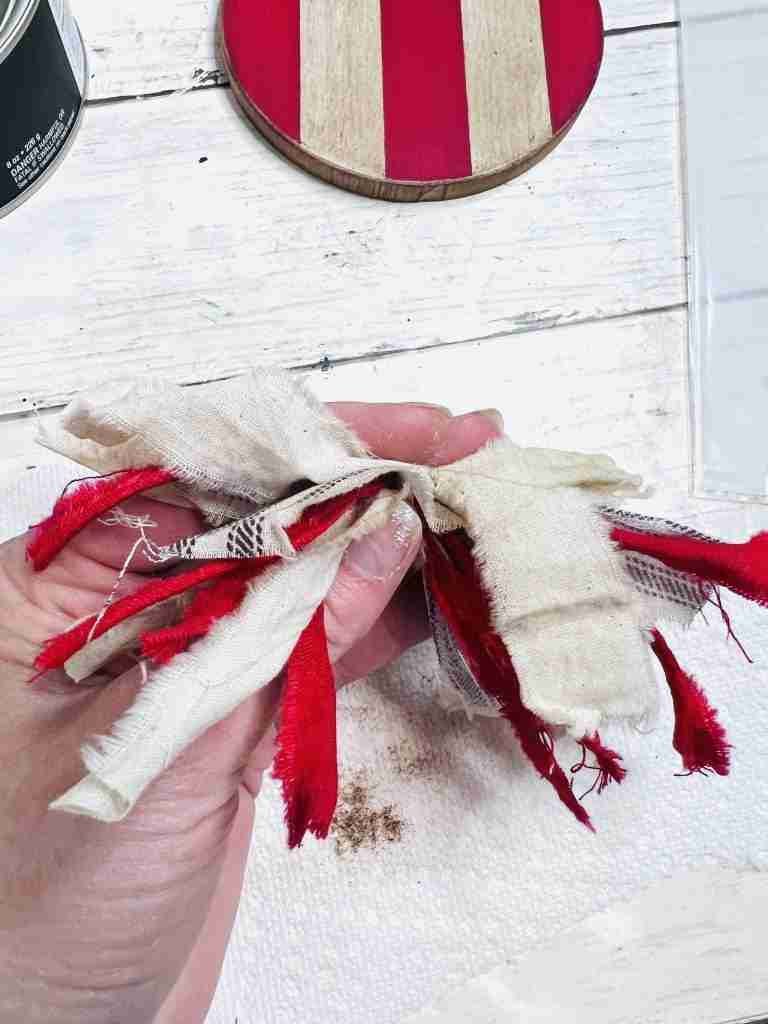 fabric strips gathered together for bow