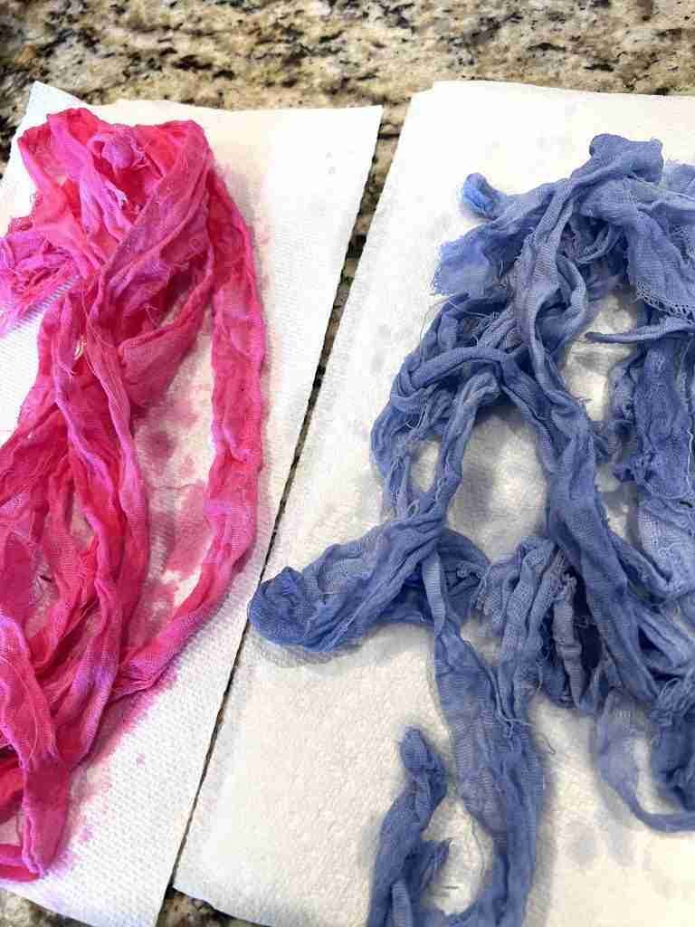 flour sack strips after being submerged into diluted paint