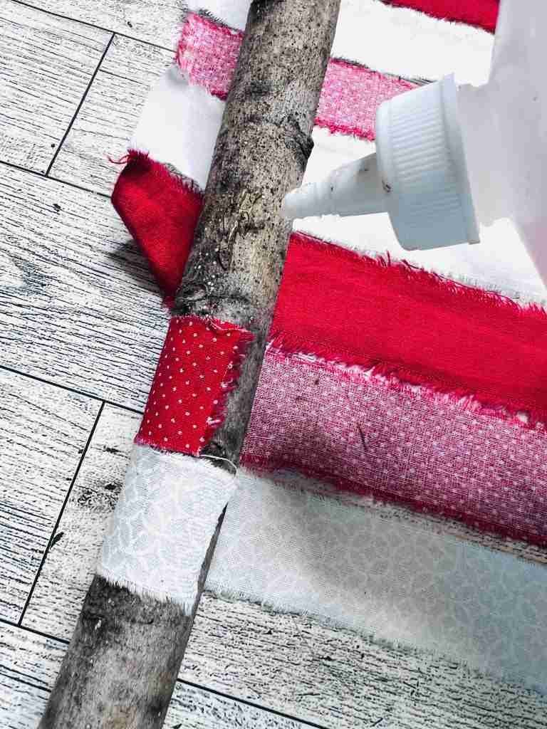 gluing strips of material to stick