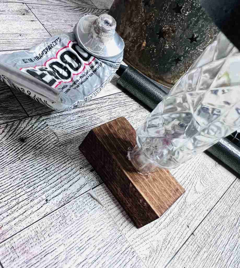 solar light glued to piece of wood