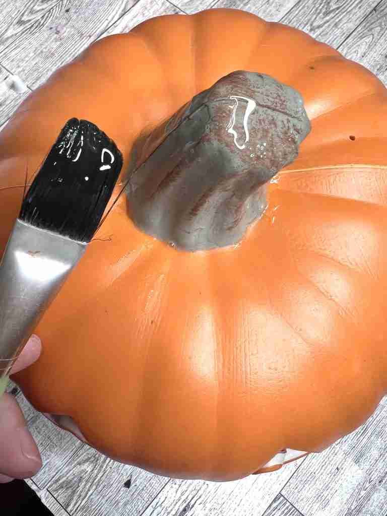 glue brushed onto existing pumpkin stem
