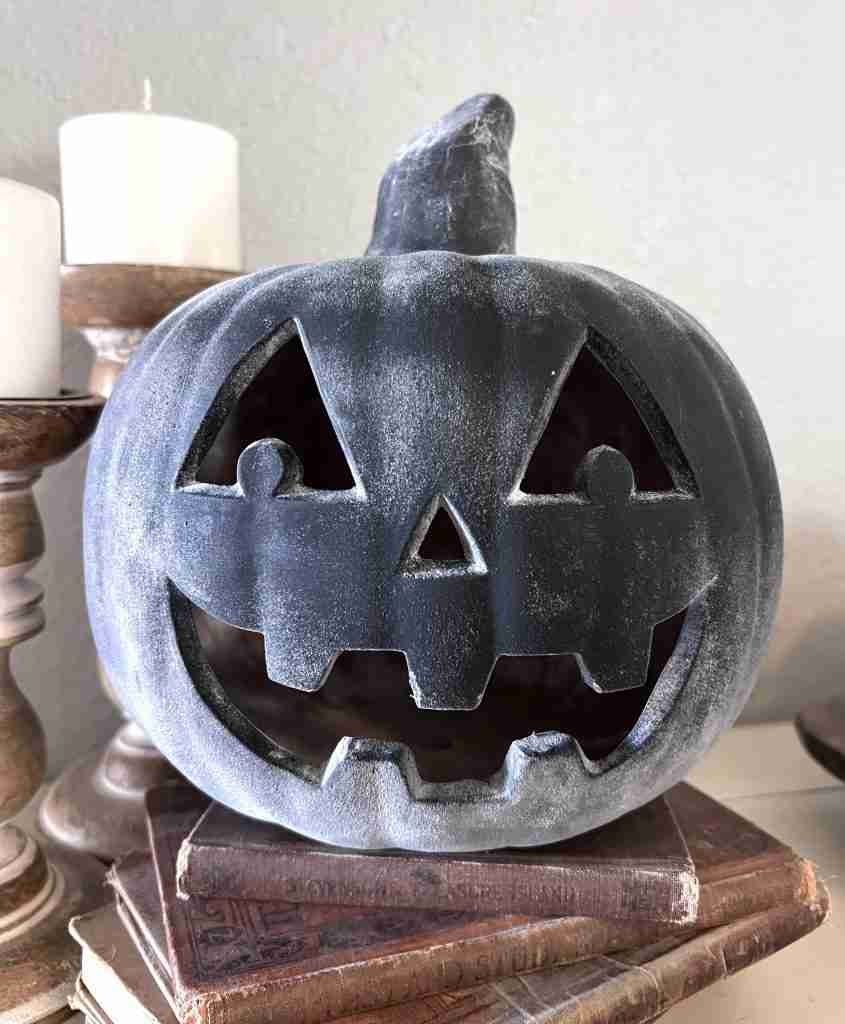 pumpkins with black spray paint and baking soda sprinkled on