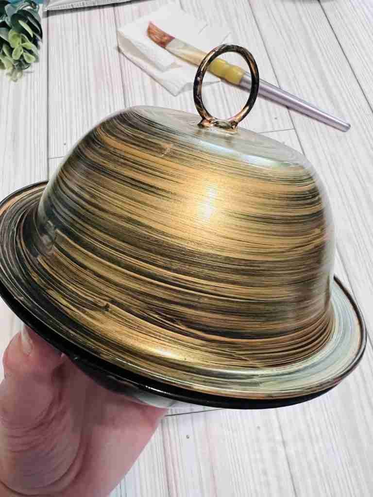 A light coat of metallic bronze paint brushed onto spray painted bowls