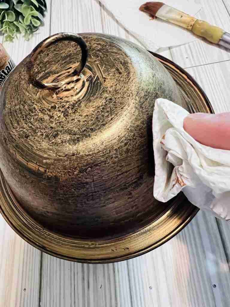 dabbing a second coat of paint on bowls