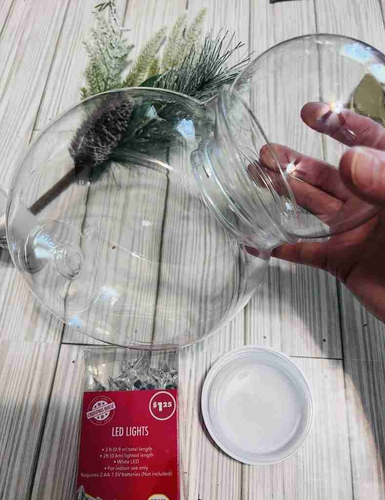 Dollar Tree plastic candy jar and plastic globe fitted together