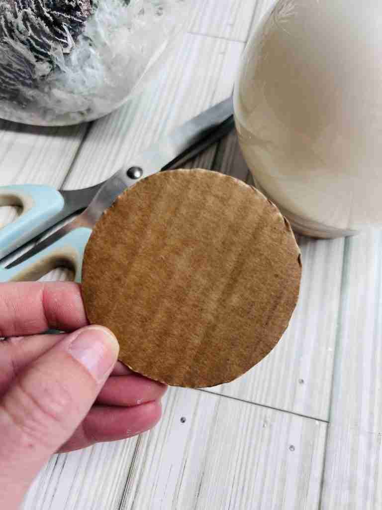 small cardboard circle for the top of the plastic snow globe