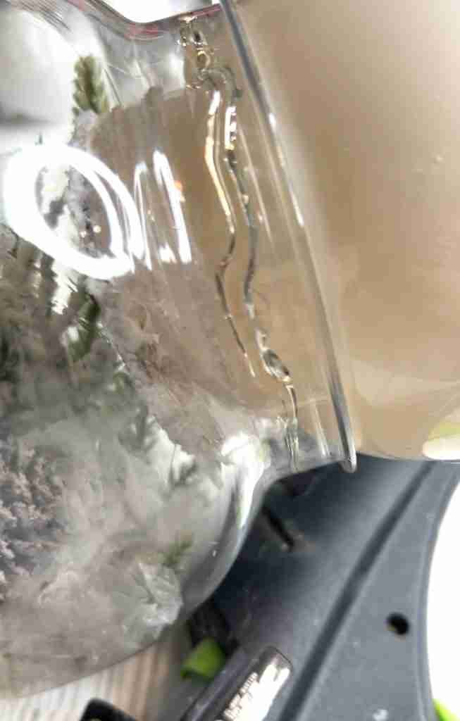 plastic globe glued into top of plastic candy container