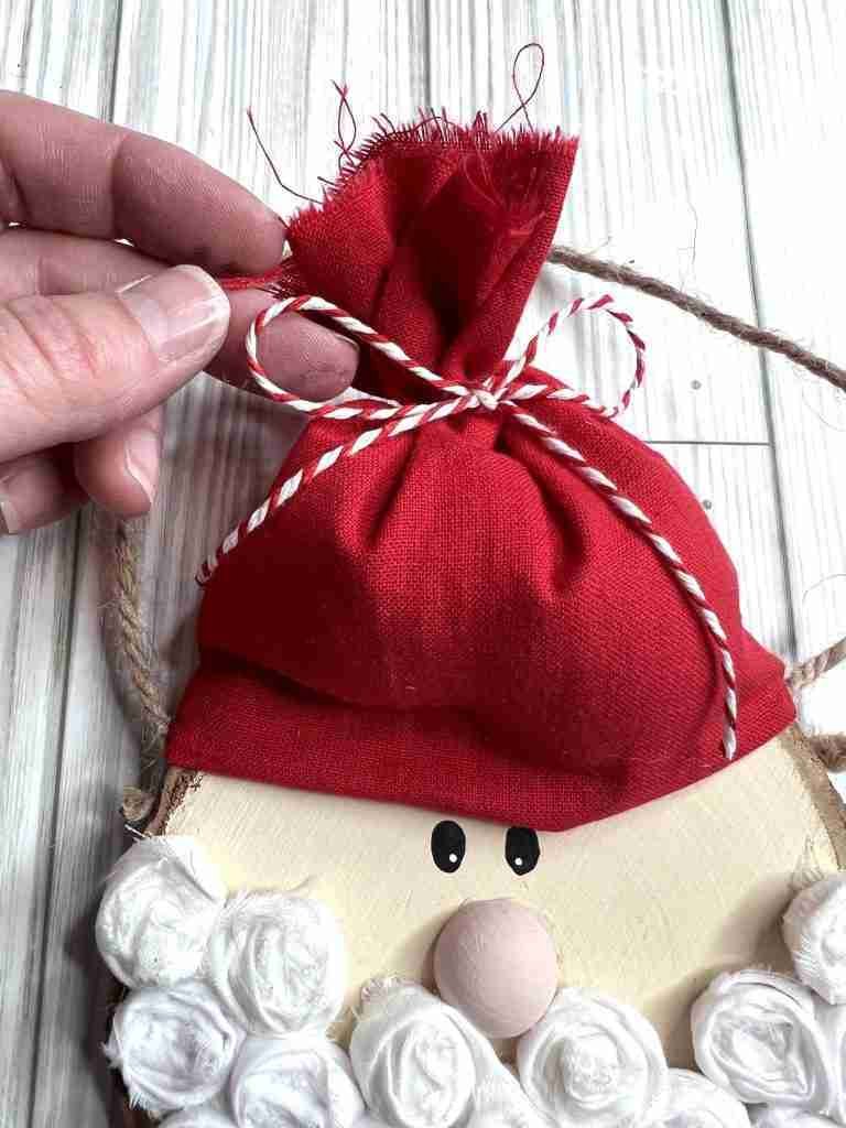 tying top of hat with baker's twine