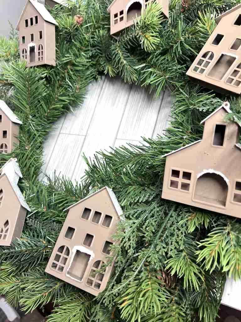 wreath with gingerbread houses attached