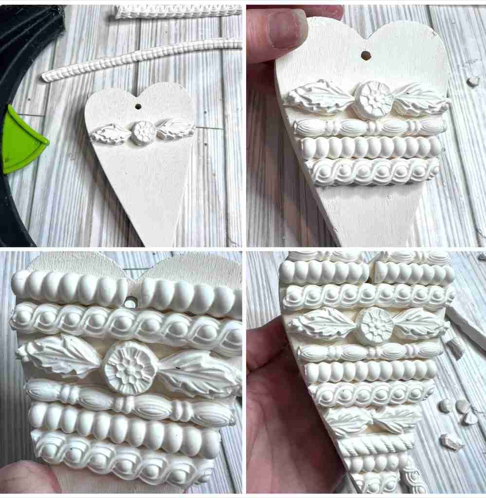 clay accents attached to wood heart