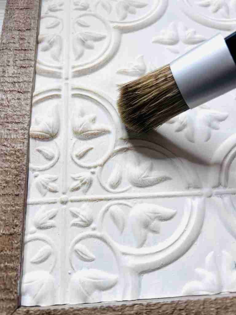 applying Behr wax to sign