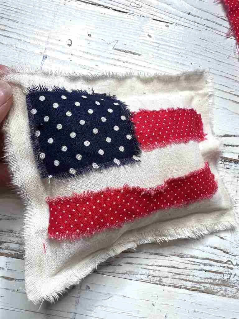 flag with material scraps glued on