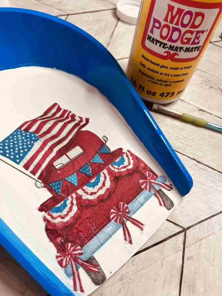 red truck cut from napkin and applied to shovel with Mod Podge