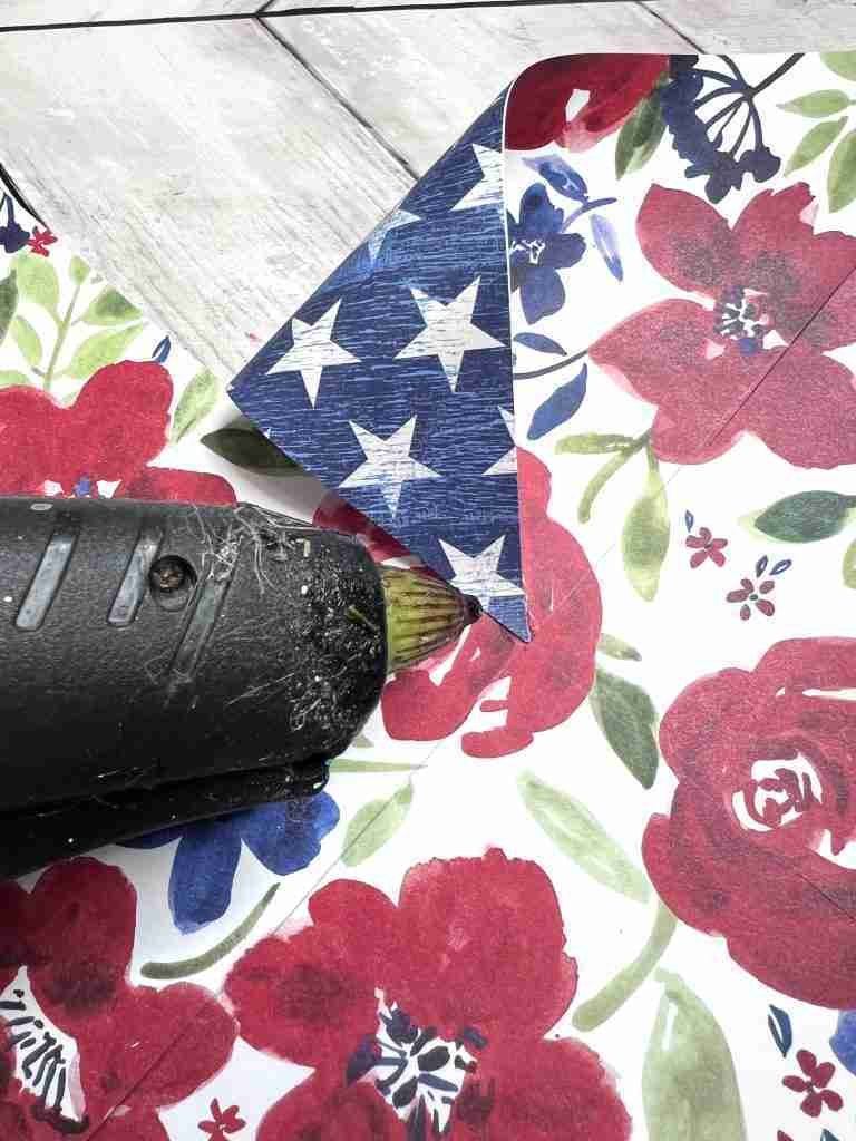 pulling every other cut section down and gluing to the center of the pinwheel