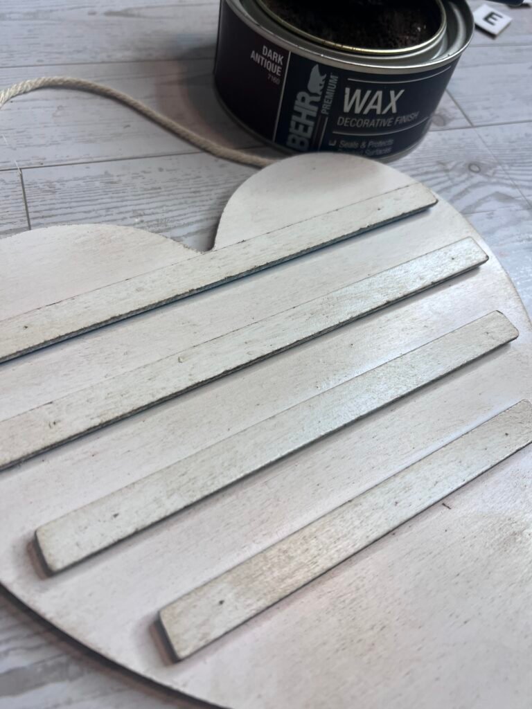 Dollar Tree DIY Letter Board painted with Rust-Oleum spray paint in Blossom White and Behr wax brushed on