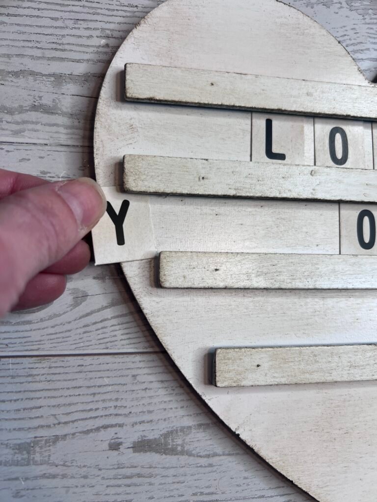 Dollar Tree DIY Letter Board and Rust-Oleum spray paint in Blossom White with letters added