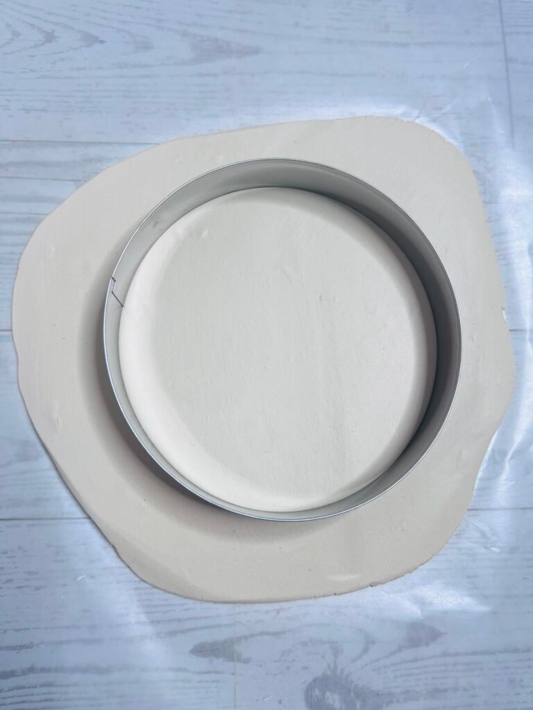 large cookie cutter pressed into clay