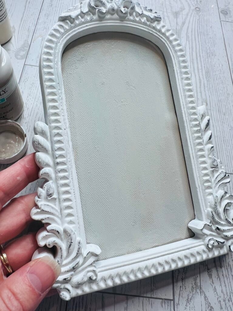 Walmart canvas frame painted with Waverly Sandstone, Milky White, and Slate Blue paint