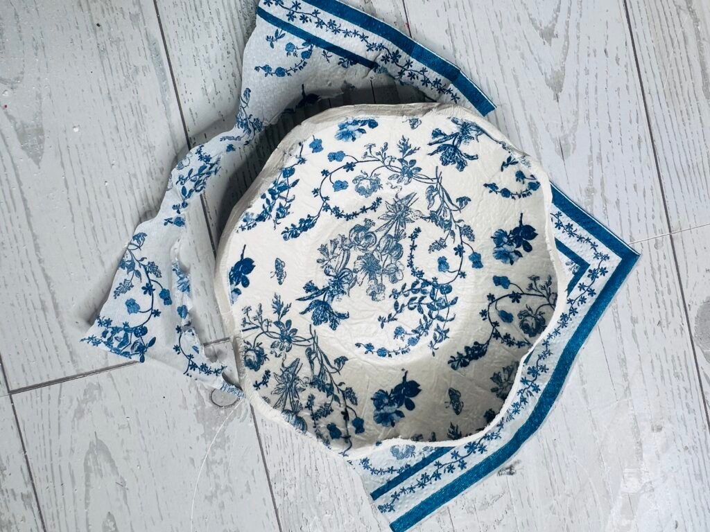 removing excess napkin with sanding block